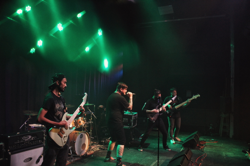 Photo of the Manitoba metalcore band Planeshifter, performing on The Park Theatre stage.