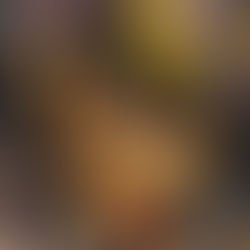 Two people lie amid flowers and fruits, under a draped yellow fabric. The mood is whimsical, with rich colors and natural patterns.