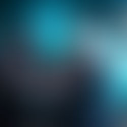 Two men playing electric guitars on stage, one sticking out his tongue. Blue lights and a screen with green patterns in the background. Rock vibe.