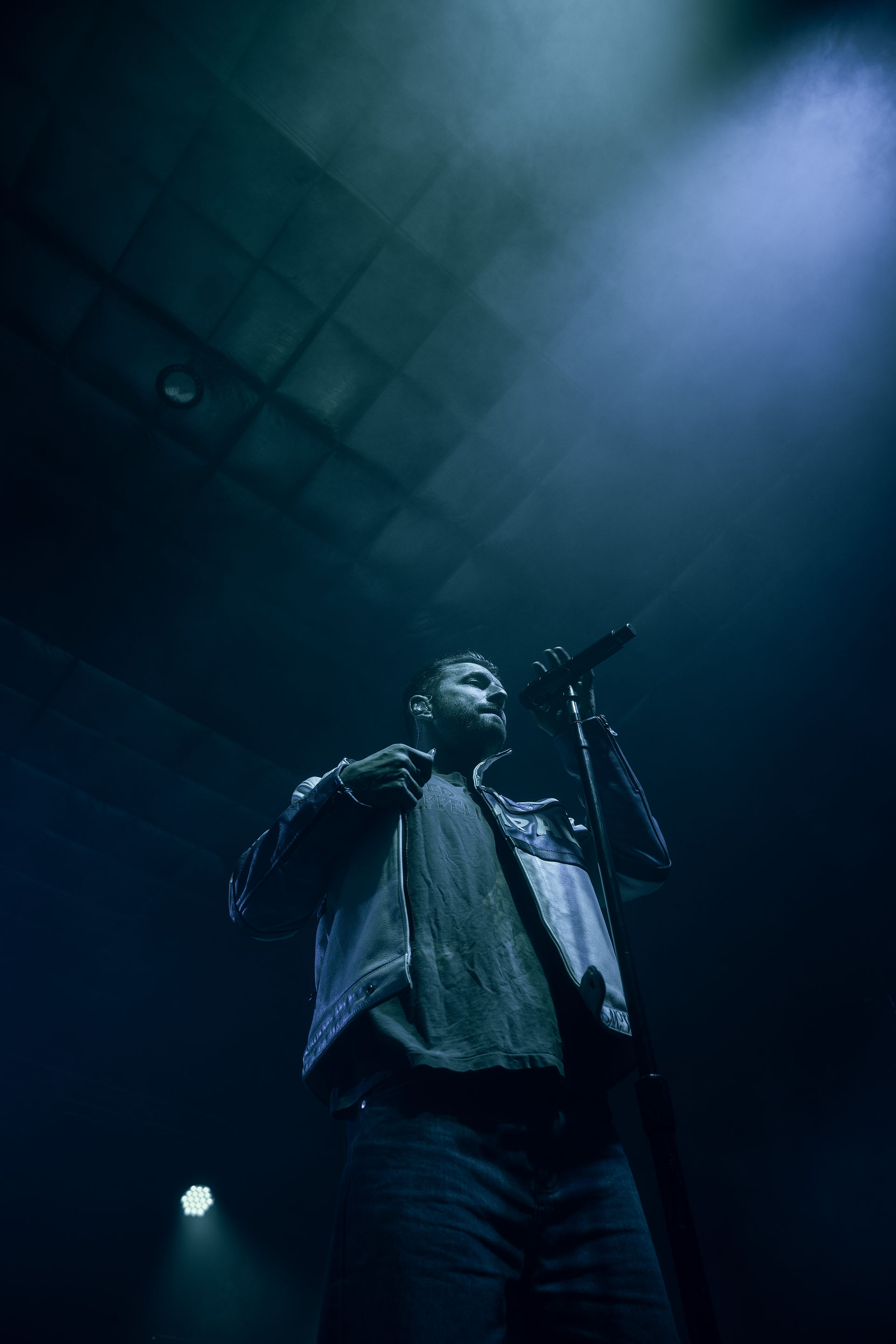 Marc E. Bassy performing on stage in Fargo.