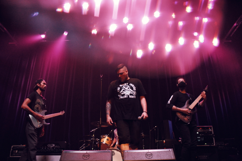 Photo of the Manitoba metalcore band Planeshifter, performing on The Park Theatre stage.