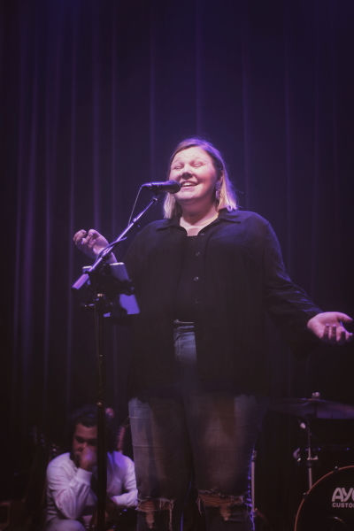 Photo of the Manitoba indie pop artist Lana Winterhalt performing on The Park Theatre stage.