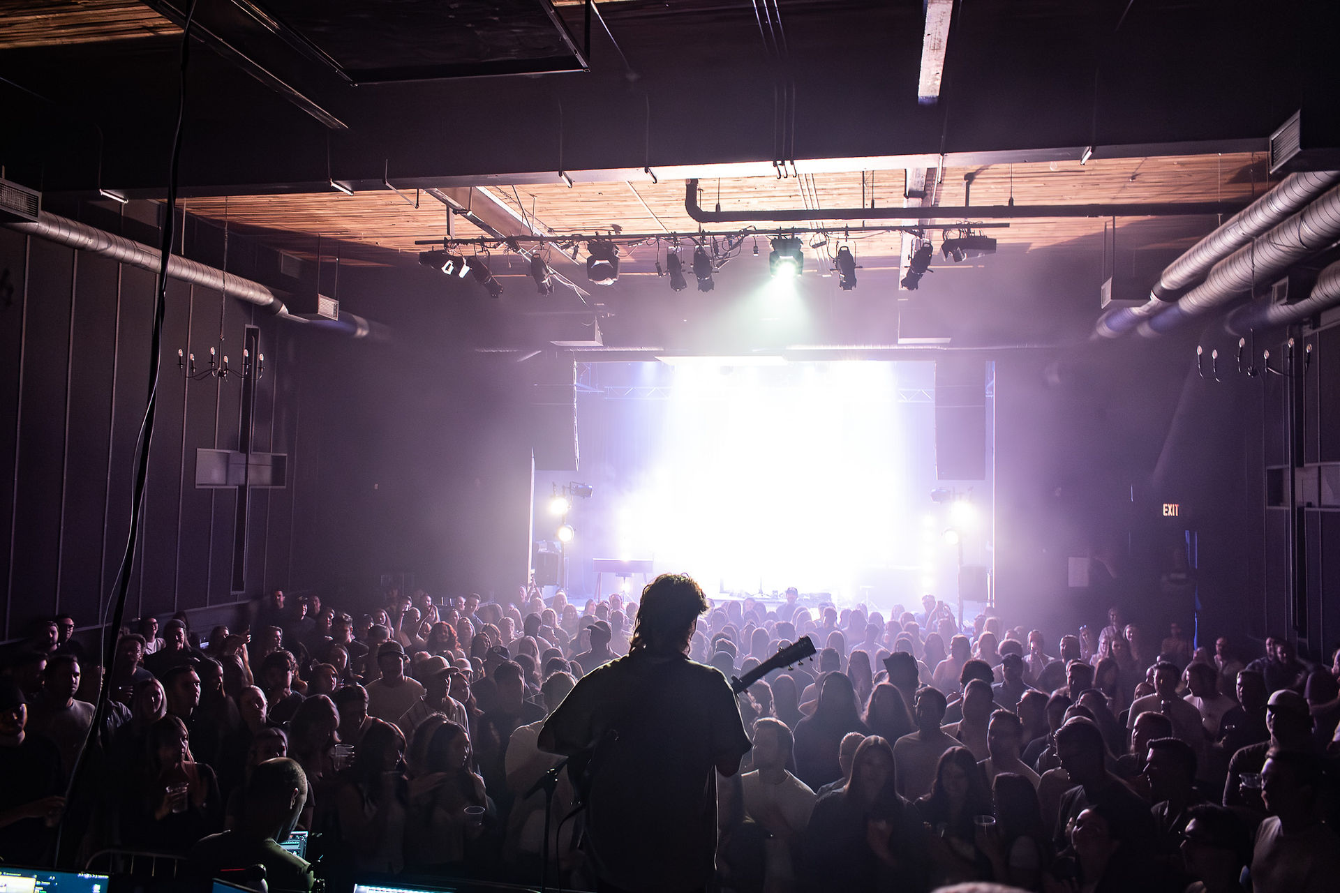 Ziggy Alberts performing a pop-up show in Winnipeg on the Park Theatre stage.