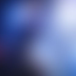 Silhouetted guitarist on stage, intense blue and purple lights create a dramatic atmosphere. Bright spotlights loom in the background.