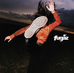Person in an orange jacket leaps at dusk, sole toward camera, with fugaz logo on a dark cloudy background.