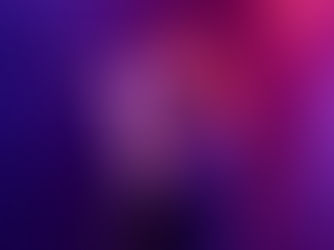 Singer with curly hair performs passionately under purple and pink stage lights, holding a microphone. The mood is energetic and vibrant.