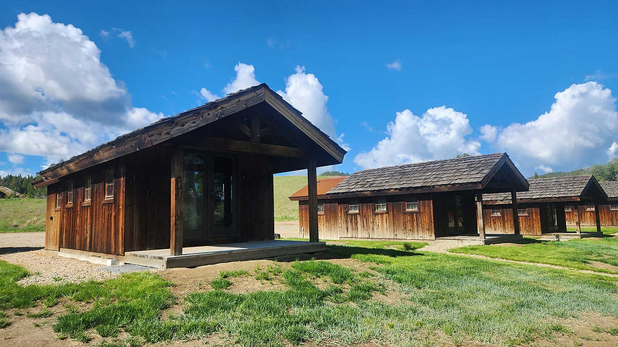 Wooden cabins at Hangman's Guest Ranch