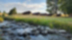 Scenic cabins by creek at Hangman's Guest Ranch