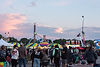 Evening crowd enjoying rides and games at Old Canal Days.