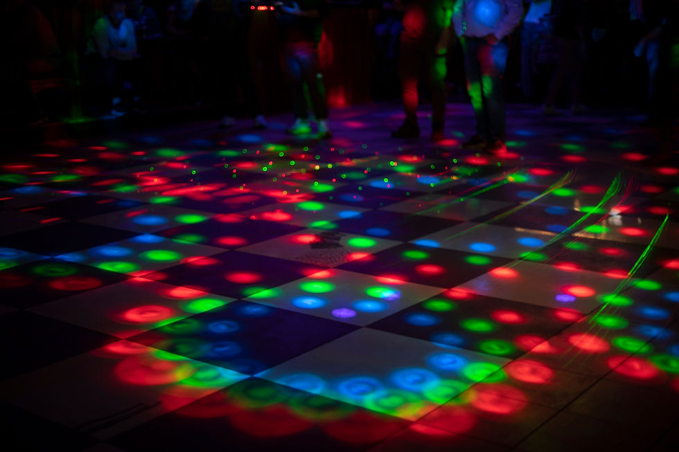 Black and white dance floor with colorful strobe lights