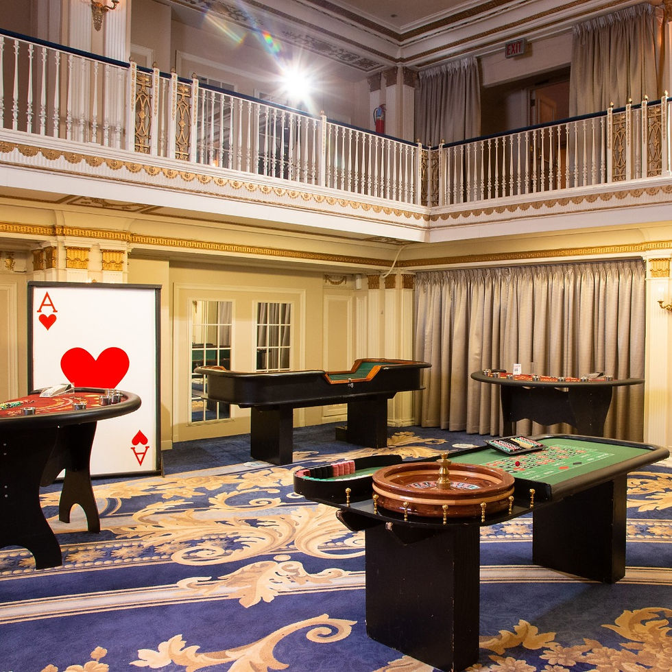 Corporate casino night gaming floor with blackjack, roulette, and craps tables in a grand ballroom — Bright Light Events and Entertainment, Chicago
