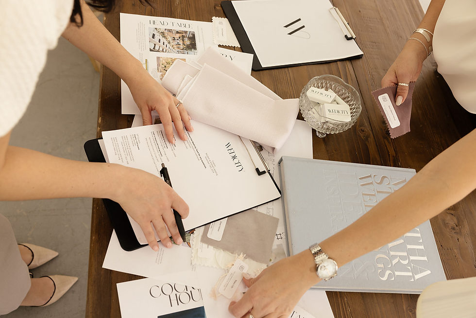Team of wedding planners hard at work planning a wedding