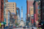 Vibrant daytime scene of Monument Circle in downtown Indianapolis.