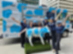 Food truck branding activation with Mendocino Farms staff posing in front of a cow-print truck, showcasing Full Food Truck Branded Wraps and a matching cow statue.