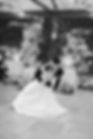Bride and groom performing a dip kiss on the dance floor