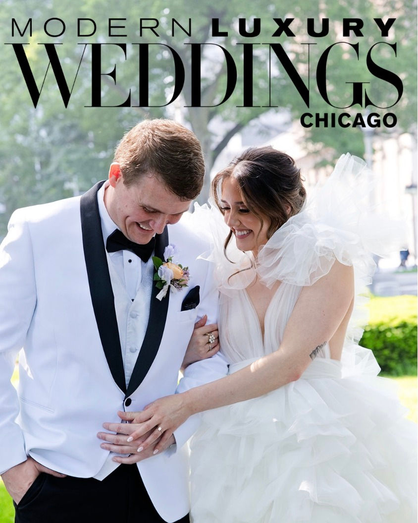 Modern Luxury Weddings Chicago feature cover image of the bride and groom in a white tuxedo and layered tulle gown.