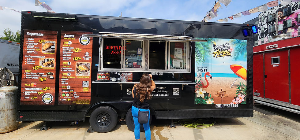 Black food truck selling mexican cuisine