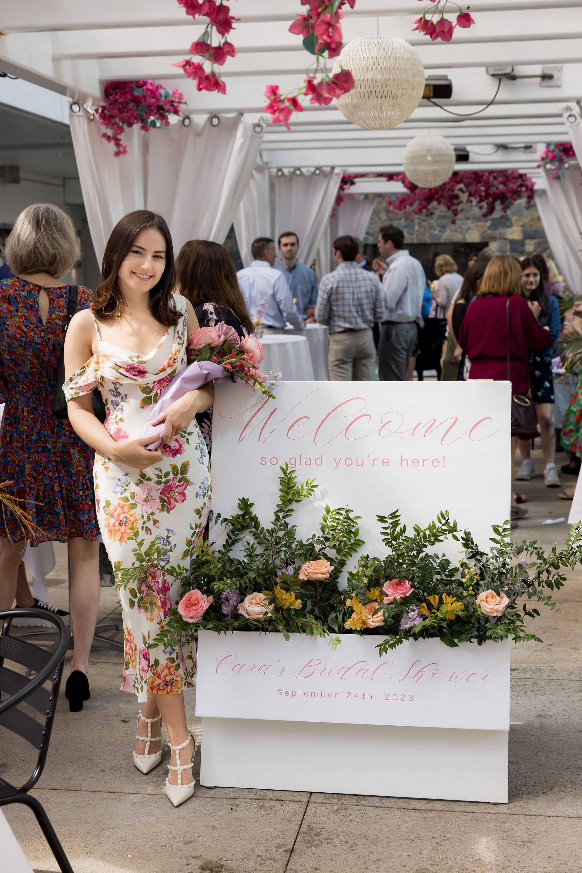 Bride to be next to welcome sign
