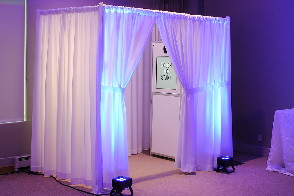 Purple curtained photo booth with LED lighting