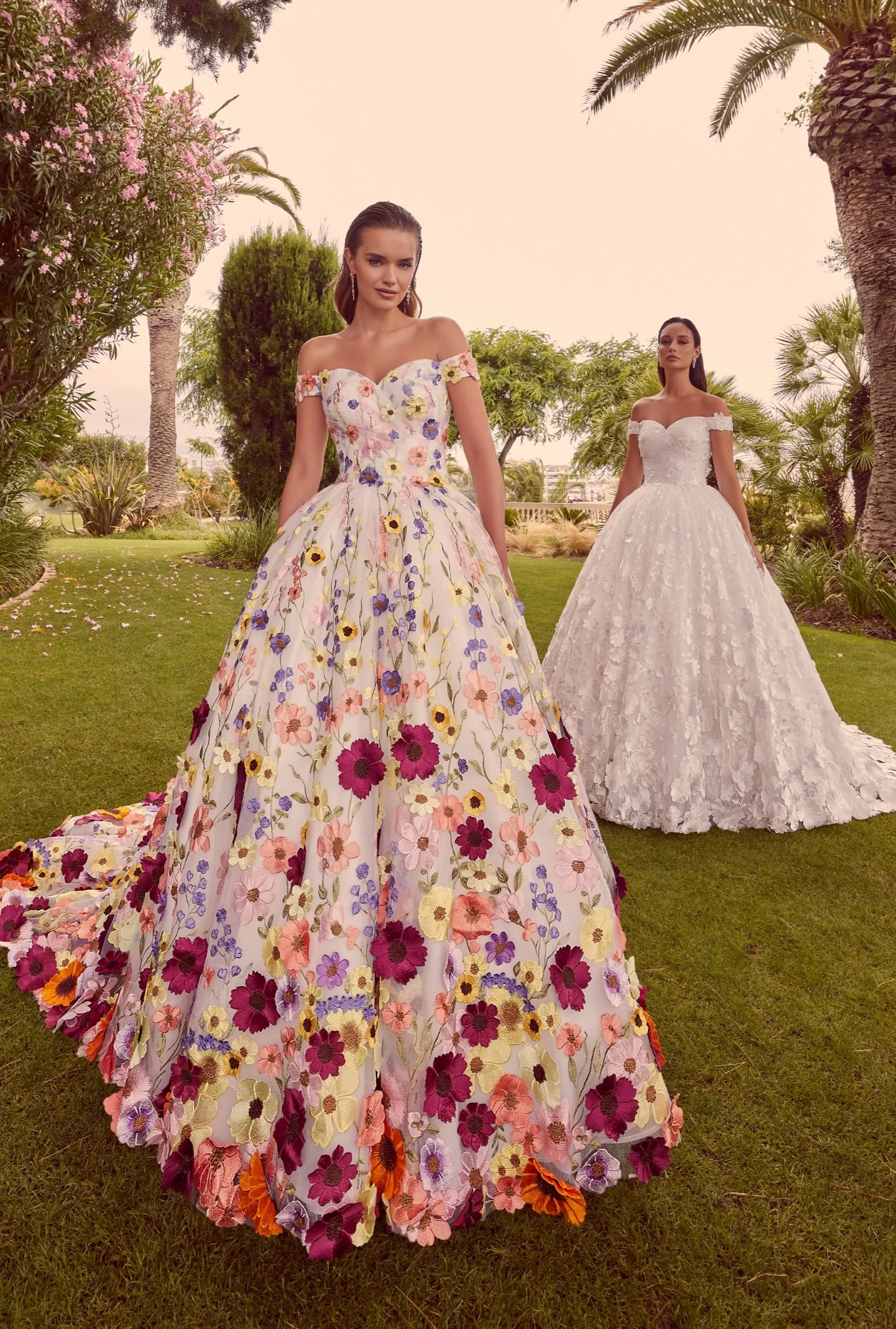 A floral dress from the Ronald Joyce Spring 2024 Bridal Collection: The Enchanted Garden Collection by Veni Infantino. 