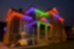 Orange, green and purple Halloween lighting theme and giant skeleton