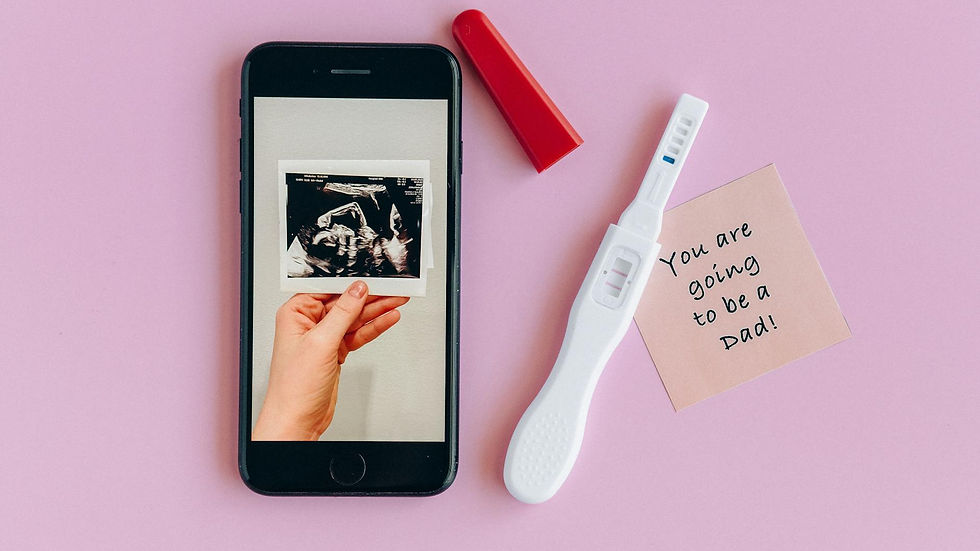 Pink background with a pregnancy test, ultrasound image, and a note for a dad-to-be.