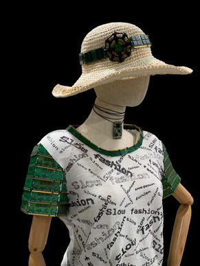 Angela Gonzalez, artbygonzalez, art, tech, technology, AI, art installation, sustainability, anthropogenic, eco-art, global warming, climate change, green, circular economy, biodiversity, planet, environment, e-waste, recycle, upcycle, reuse, eco-friendly, organic, overpopulation, local extinction, deforestation, migration, erosion, water pollution, social equity, overconsumption, microplastics, air-pollution, colombian artist, NC, fashion, greenwashing, sale, clearance, handmade, custom-made, mannequin, pay forever, buy now, landfills, garments, social justice, labor practices, awareness, rethink, fair labor practices, fair trade, ZARA, slow fashion, computer components, gold, manifesto, stitch, couture, toxic chemicals, dyes, cotton, polyester, hemp, bamboo, mushroom-based fabrics, fabrics, 3D printing, hose, spigot, water nozzle, mannequin, nature, haute, carbon emissions, carbon footprint, second-hand, transportation,, greenhouse gases, textiles, transparency, education, third-party verification, consciousness, dollars, vogue, overproduction, materialism, resale, rental services, repair, ads, multimedia, sewing machine, throwaway culture, pesticide, textile waste