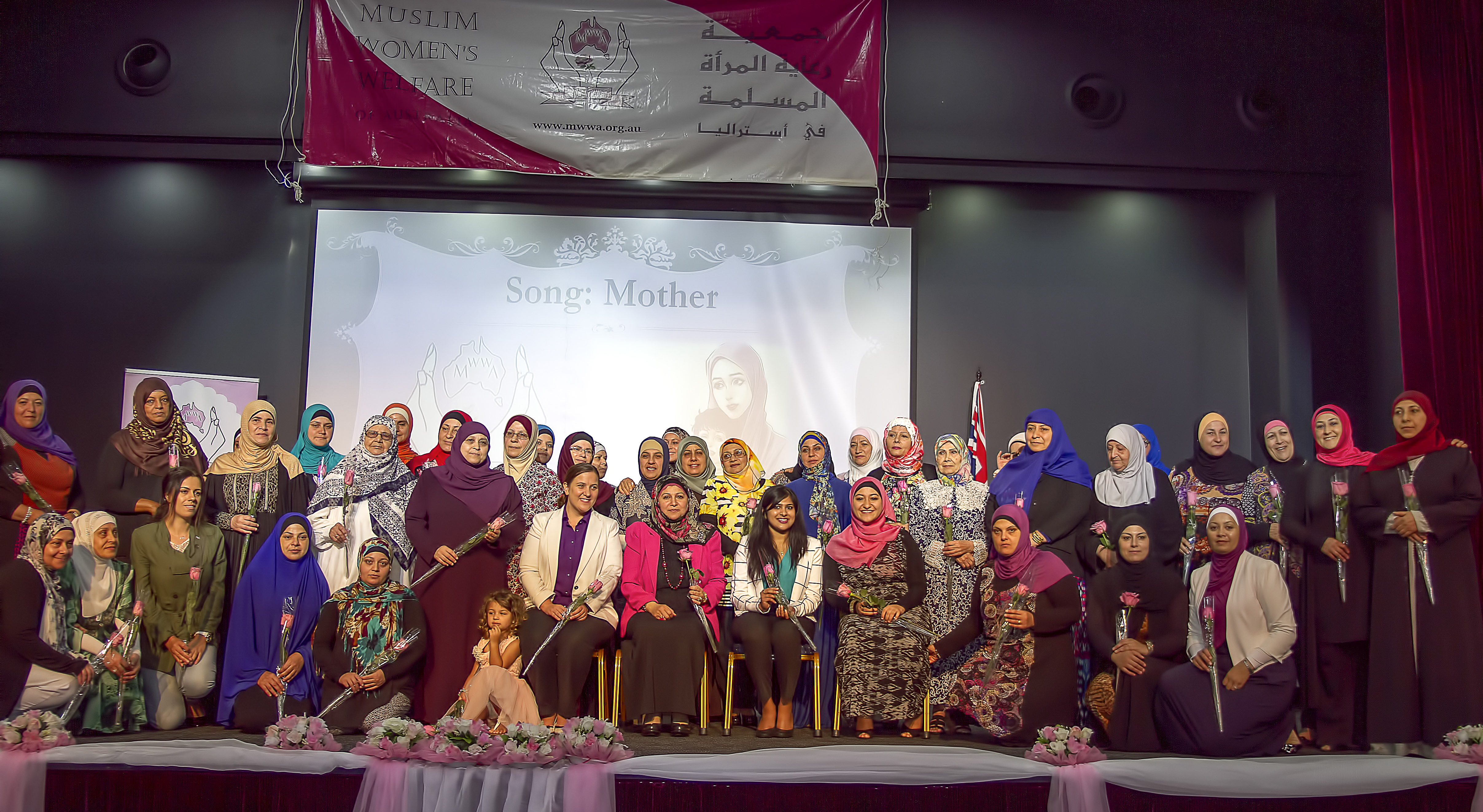 Senior women receiving token of appreciation