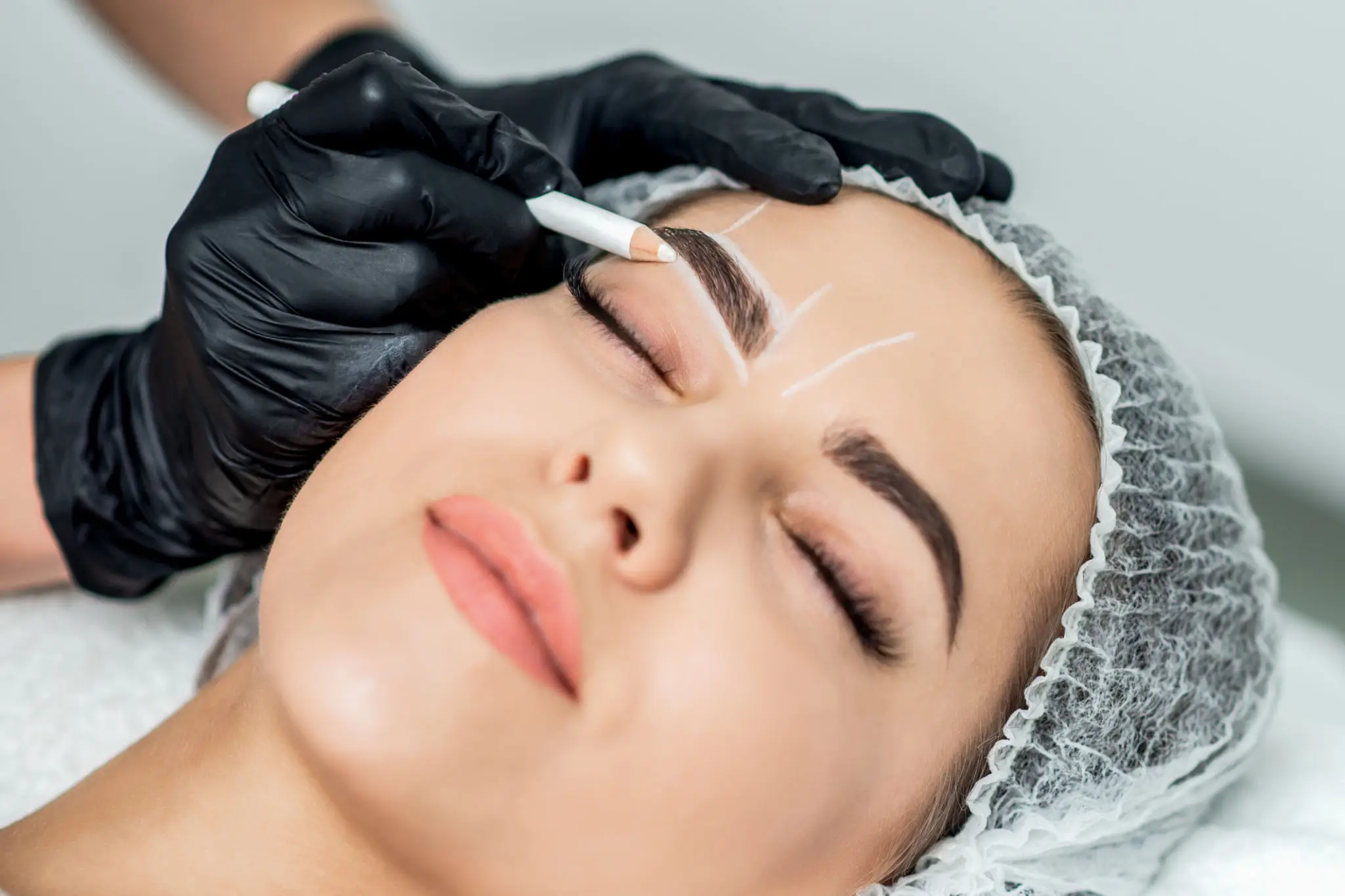 Permanent eyebrow makeup removal using saline solution at Red Carpet Luxury Spa in Rockland County, gently breaking down pigment for effective and safe tattoo removal.