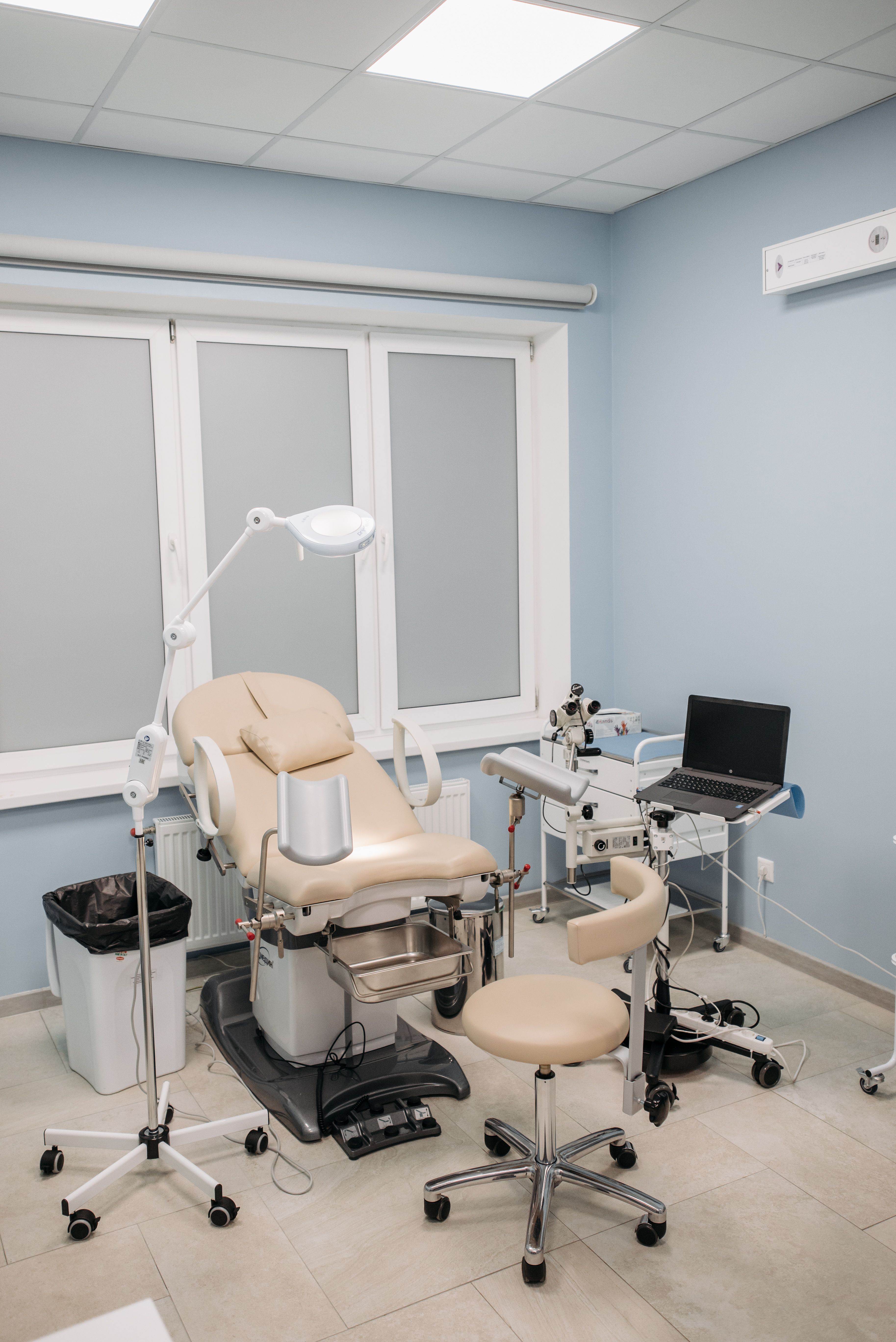 A clean, empty clinic examination room prepared for healthcare photography, with no patients or visible personal information.
