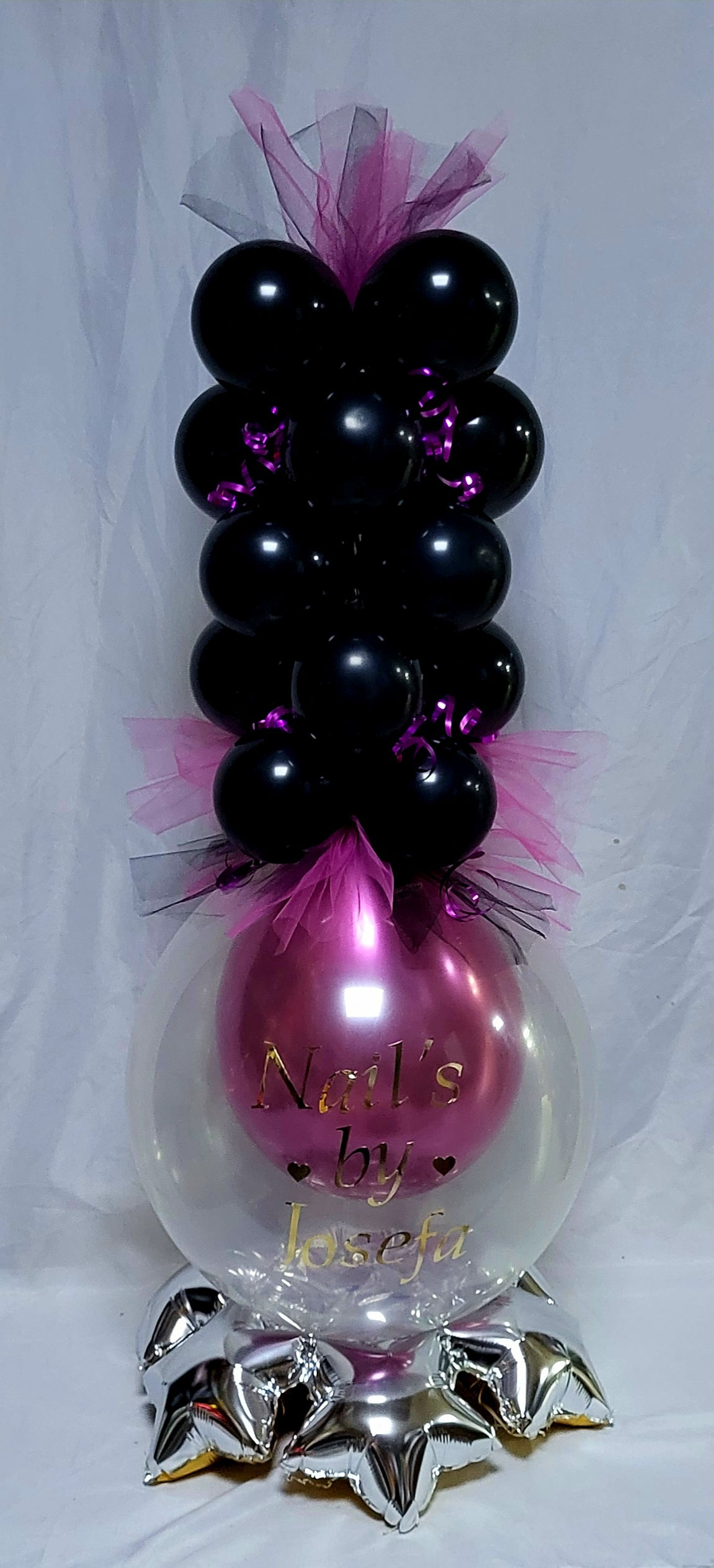 Nail polish centrepiece using  chrome inner balloon on star base with mini ball.