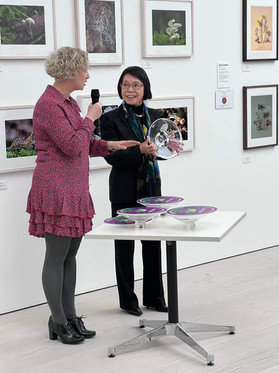 Charlotte Brooks presenting Yoko Harada Gold medal winner at the RHS botanical & Photography show