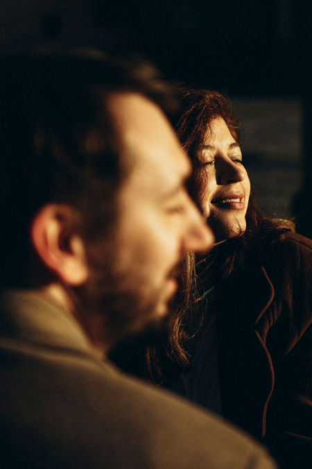 close-up of couple's faces in a beautiful sunrise in Florence