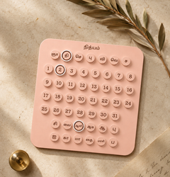 Blush painted surface and wood grain detail on Nithyam Arambh Tamil Edition perpetual calendar