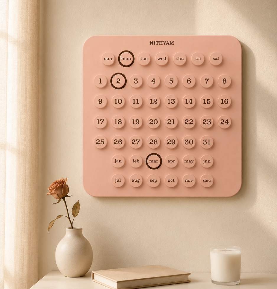 Nithyam Pratham English Edition perpetual calendar mounted on wall in Blush