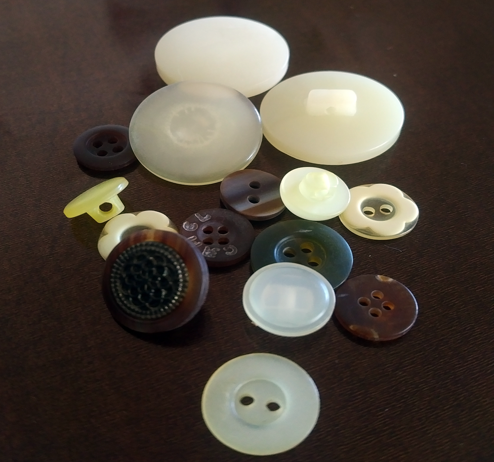 assorted brown and light coloured mix buttons