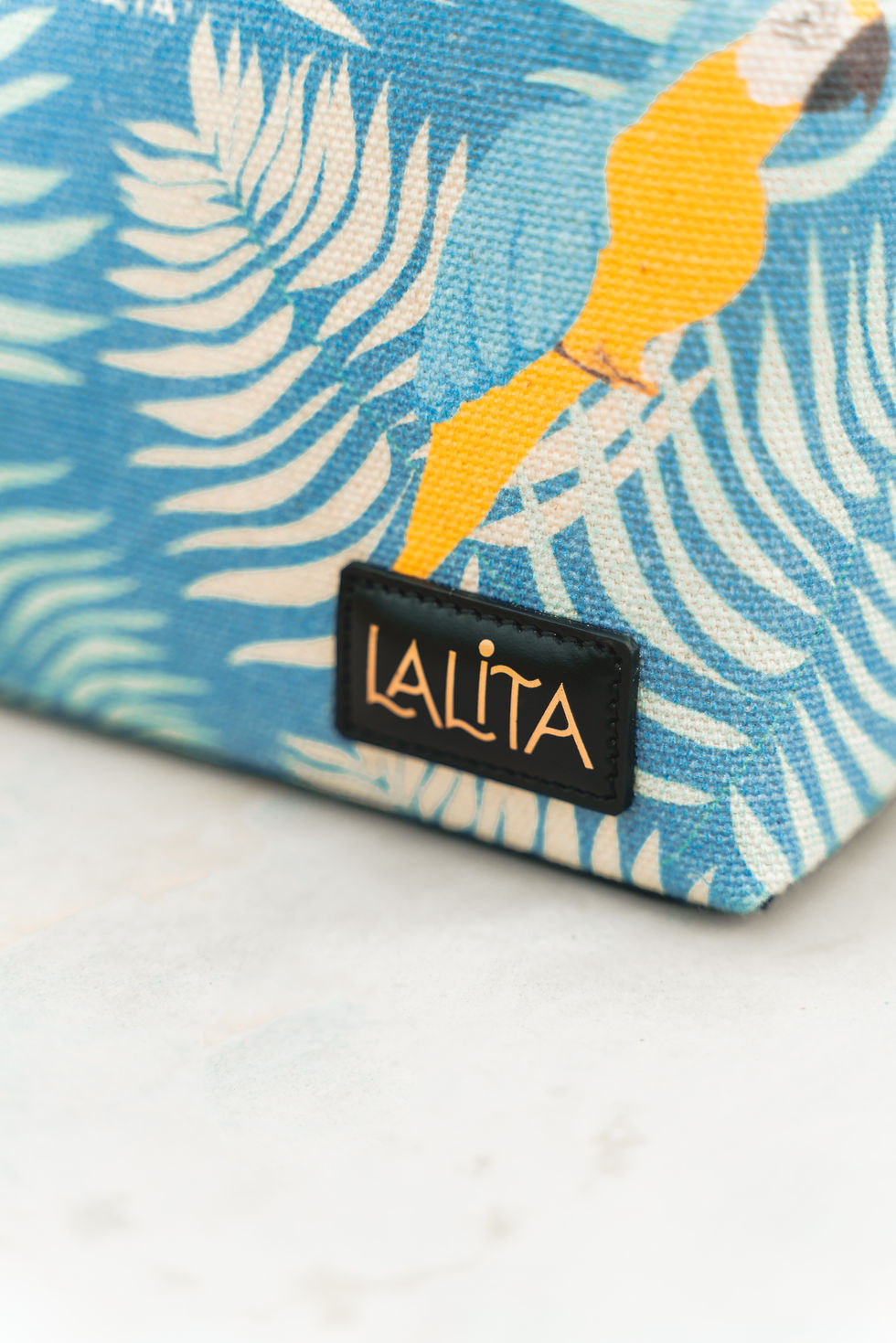 Thumbnail: LALITA bag tag on a blue patterned tote with visible text. LALITA bag.