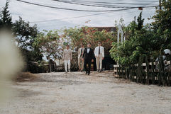 Groom and groomsmen walking on a path at Wedding Đ&PA – Da Lat