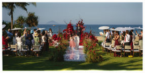 Bride walking down the aisle at a beach destination wedding – Hoiana Resort
