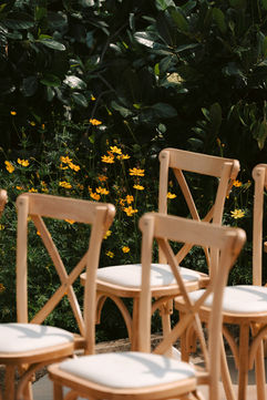 Wooden cross-back chairs at an intimate outdoor wedding – garden wedding at home, Vietnam