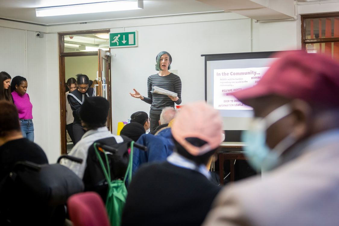 Stock photograph of a presenter addressing an adult-learning group