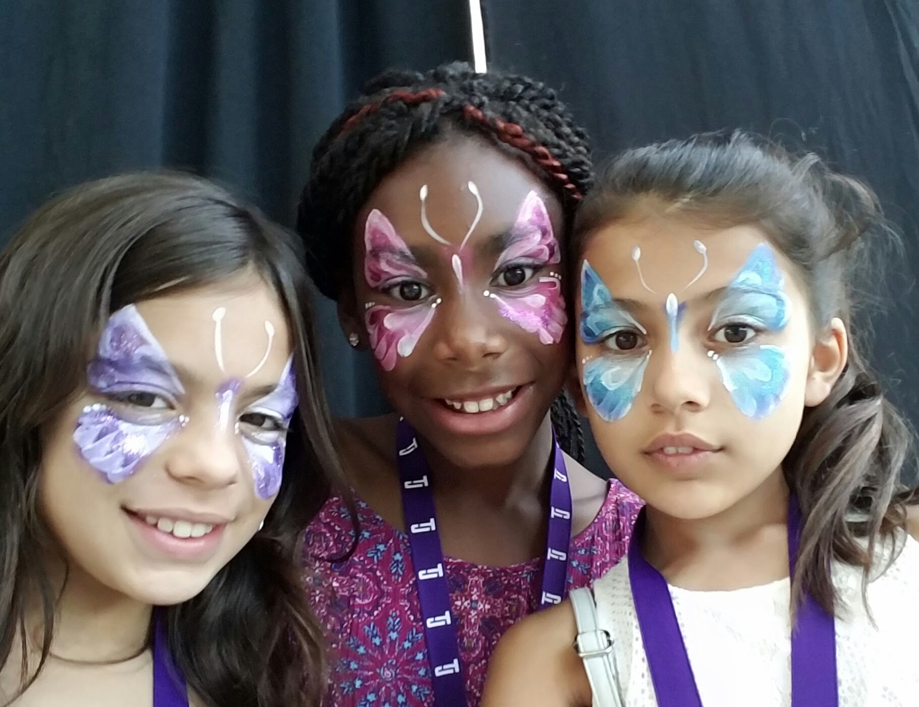 Pastel butterfly face paint besties