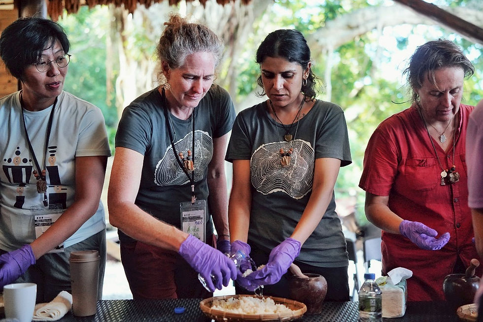 AWA partners from India, Amanda (far right) and Tanya (second from right), making millet wine.