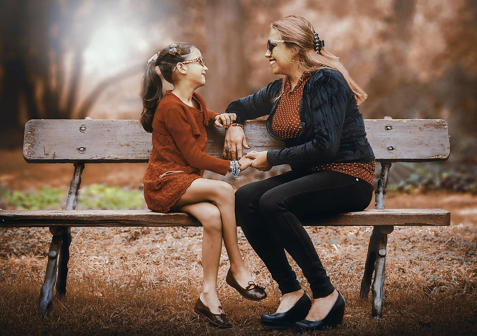 mother and daughter on bench