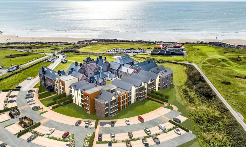 The apartment complex from above showing the car park, golf course and beach.