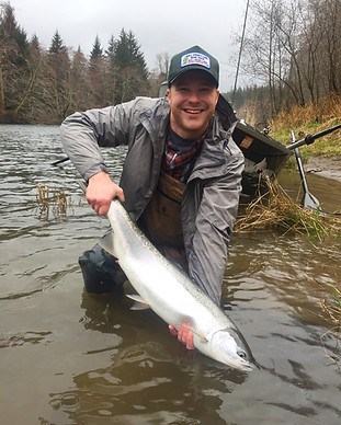 Fly fishing angler with Sol Duc River Steelhead