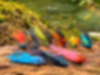 9 Fishing Flies on log by river