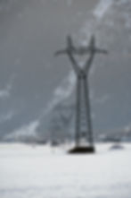vertical-shot-transmission-tower-with-snowy-surface-winter.jpg