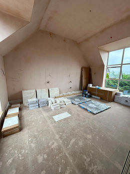 Attic room renovation with tiles and plasterboard.
