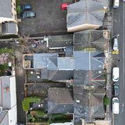 Aerial view of residential slate rooftops in Project Kings.